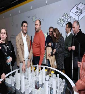 Blind visitors experiencing a tactile model