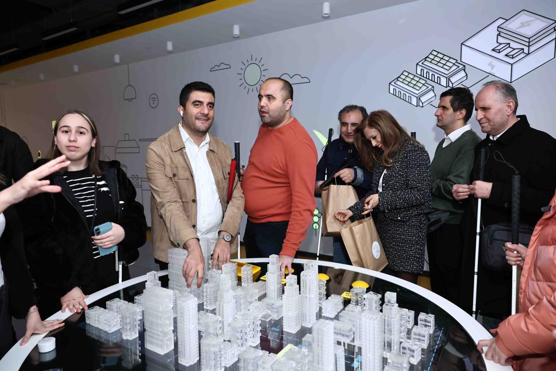 Blind visitors experiencing a tactile model